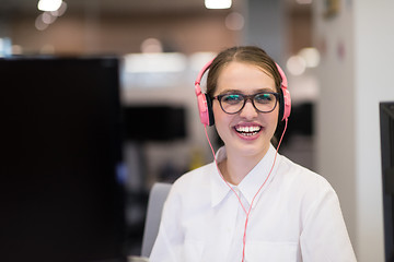 Image showing businesswoman using a laptop in startup office