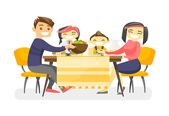 Image showing Happy multiethnic family dining at the table.