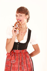 Image showing Bavarian woman with pretzel in his hand