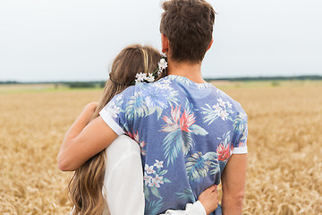 Image showing smiling young hippie couple over minivan car