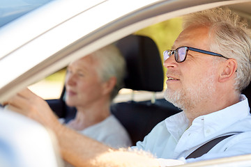 Image showing happy senior couple driving in car