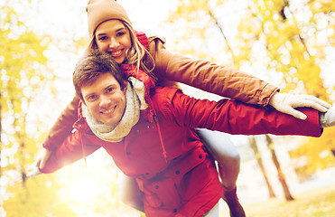 Image showing happy young couple having fun in autumn park