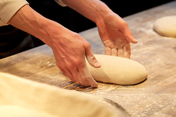 Image showing chef or baker cooking dough at bakery