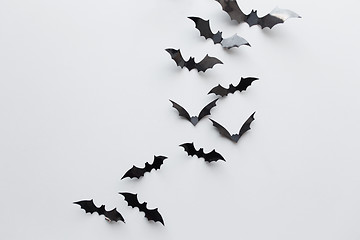 Image showing black paper bats over white background