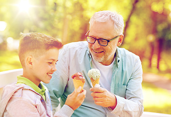 Image showing old man and boy eating ice cream at summer park