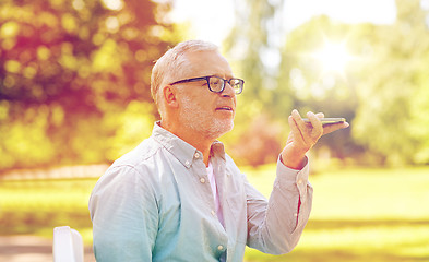 Image showing old man using voice command recorder on smartphone