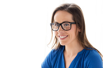 Image showing close up of smiling middle aged woman in glasses