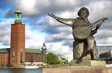 Image showing Evert Taube monument on Gamla Stan and City Hall in Stockholm, S