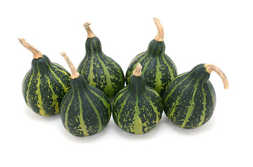 Image showing Group of six green spinning gourds