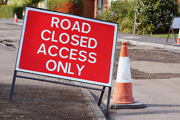 Image showing ROAD CLOSED ACCESS ONLY road sign with a traffic cone