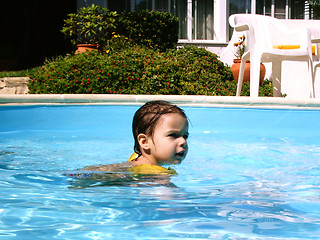 Image showing 3 year's old girl swimmig