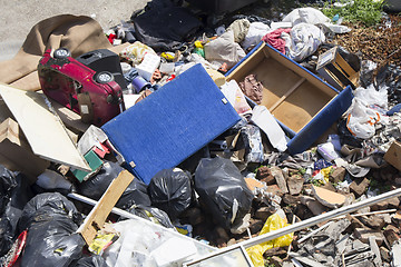 Image showing Various household waste and garbage thrown away on the street