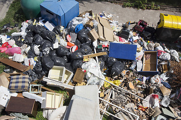 Image showing Various household waste and garbage thrown away on the street