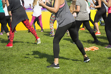 Image showing Group of young girls exercising fitness with dancing in the city