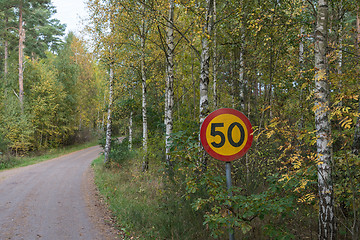 Image showing Speed limit traffic sign by a gravel road