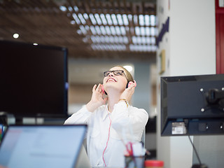 Image showing businesswoman using a laptop in startup office