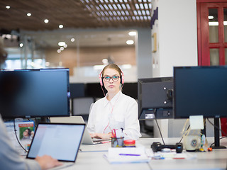 Image showing businesswoman using a laptop in startup office