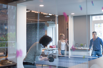 Image showing startup business team playing ping pong tennis