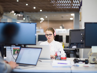 Image showing businesswoman using a laptop in startup office