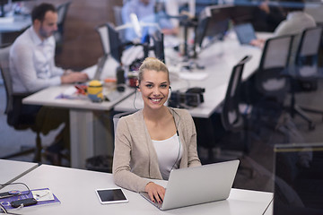 Image showing businesswoman using a laptop in startup office