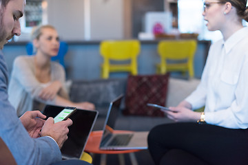 Image showing Young casual businessman using smartphone