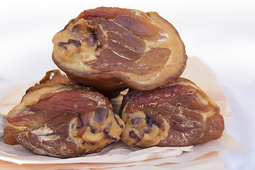 Image showing Three Smoked ham hock on paper in butcher shop