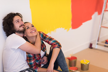 Image showing Happy young couple relaxing after painting