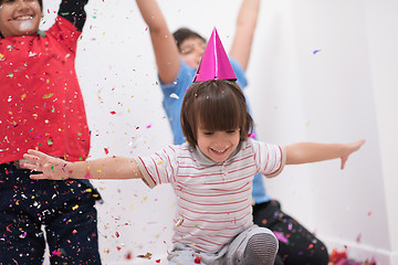 Image showing kids  blowing confetti