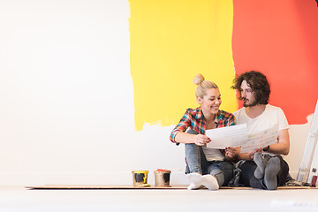 Image showing Happy young couple relaxing after painting