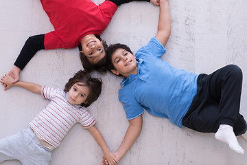 Image showing young boys having fun on the floor