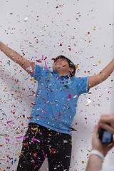 Image showing kid blowing confetti