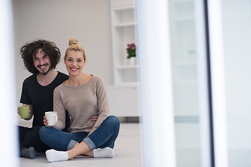 Image showing young couple in their new home