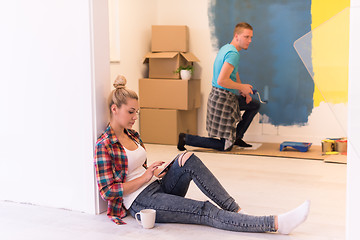 Image showing couple doing home renovations