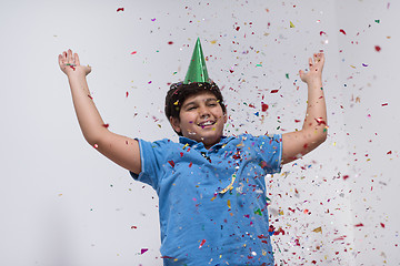 Image showing kid blowing confetti