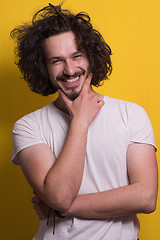 Image showing young man with funny hair over color background