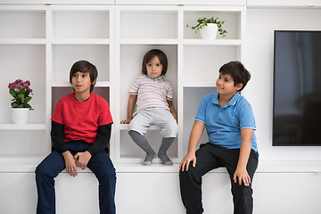 Image showing young boys posing on a shelf