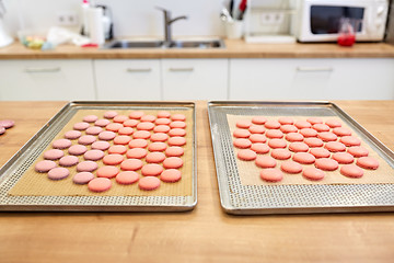 Image showing macarons on oven trays at confectionery