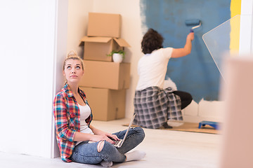 Image showing Happy couple doing home renovations