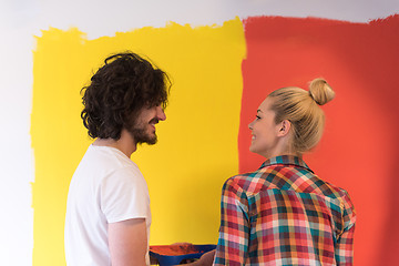 Image showing couple painting interior wall