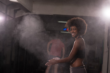 Image showing black woman preparing for climbing workout