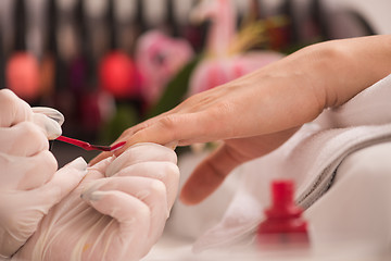 Image showing Woman hands receiving a manicure