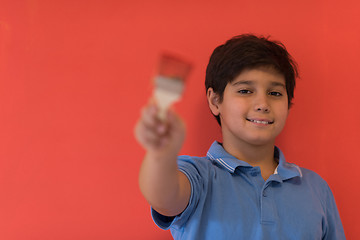 Image showing Portrait of a happy young boy painter