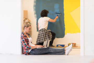 Image showing Happy couple doing home renovations