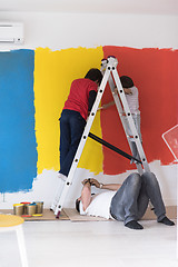 Image showing boys painting wall