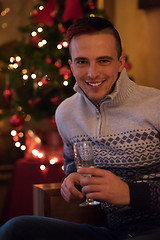 Image showing Happy young man with a glass of champagne