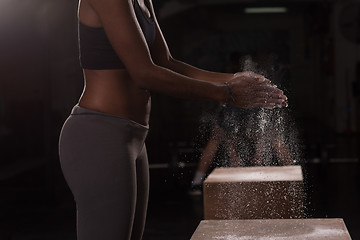 Image showing black woman preparing for climbing workout