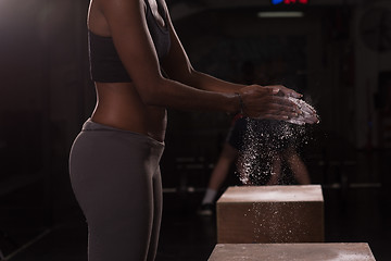 Image showing black woman preparing for climbing workout