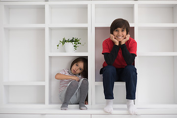 Image showing young boys posing on a shelf