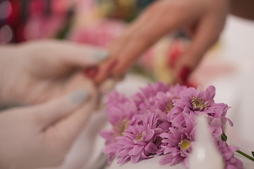 Image showing Woman hands receiving a manicure