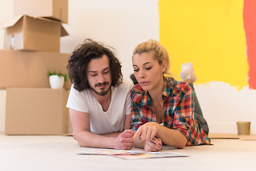 Image showing Happy young couple relaxing after painting